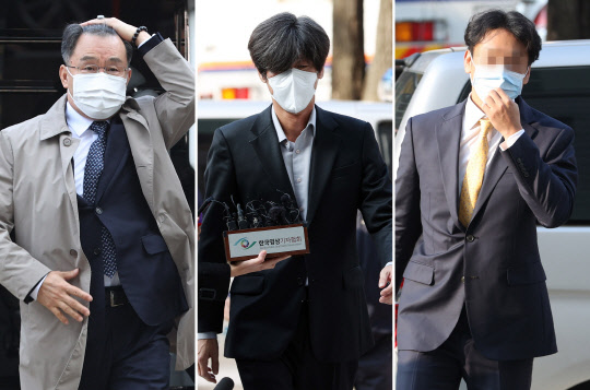 구속영장이 청구된 대장동 개발 로비·특혜 의혹의 핵심 인물인 화천대유 대주주 김만배(왼쪽)씨와 천화동인 4호 소유주 남욱(가운데) 변호사, 정민용 전 성남도시개발공사 전략사업실장이 3일 영장실질심사를 받기 위해 서울 서초동 서울중앙지법 법정으로 들어가고 있다. 연합뉴스